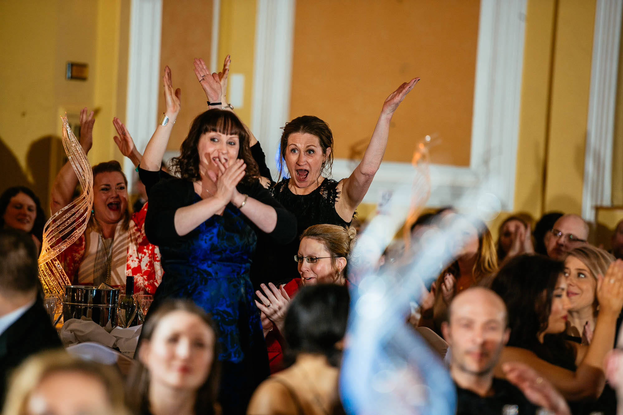 Event with people standing up celebrating