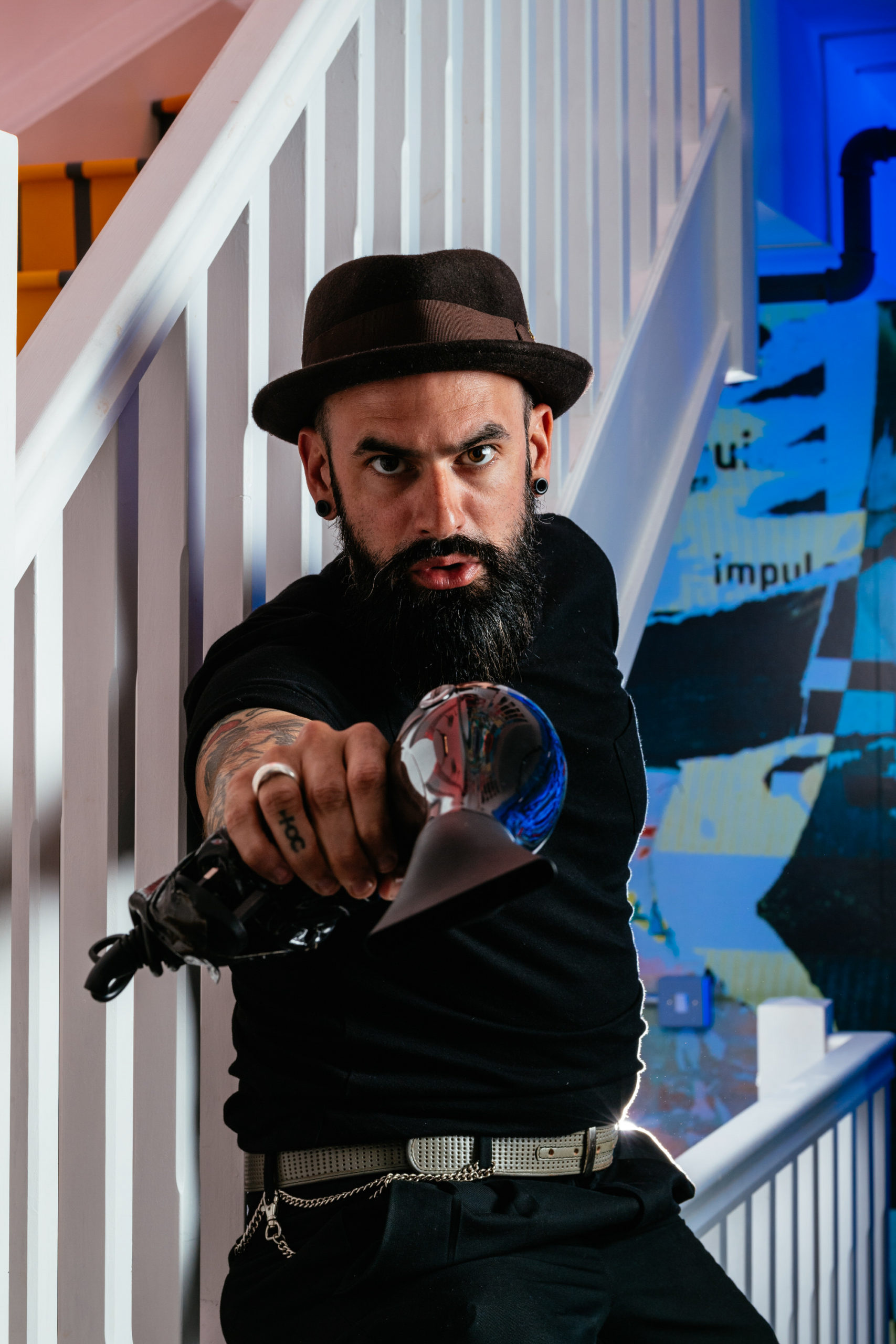 portrait of a man with a beard and hair dryer