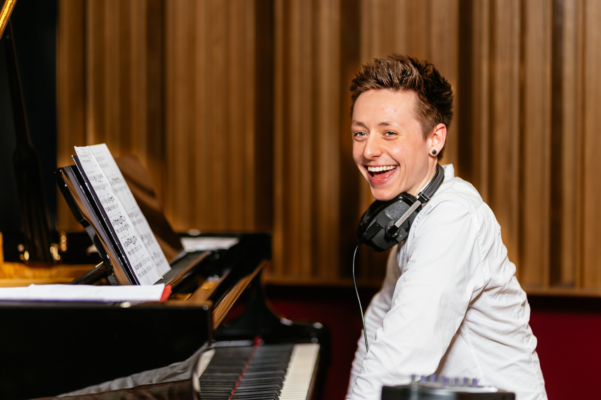 portrait of a man smiling playing the piano